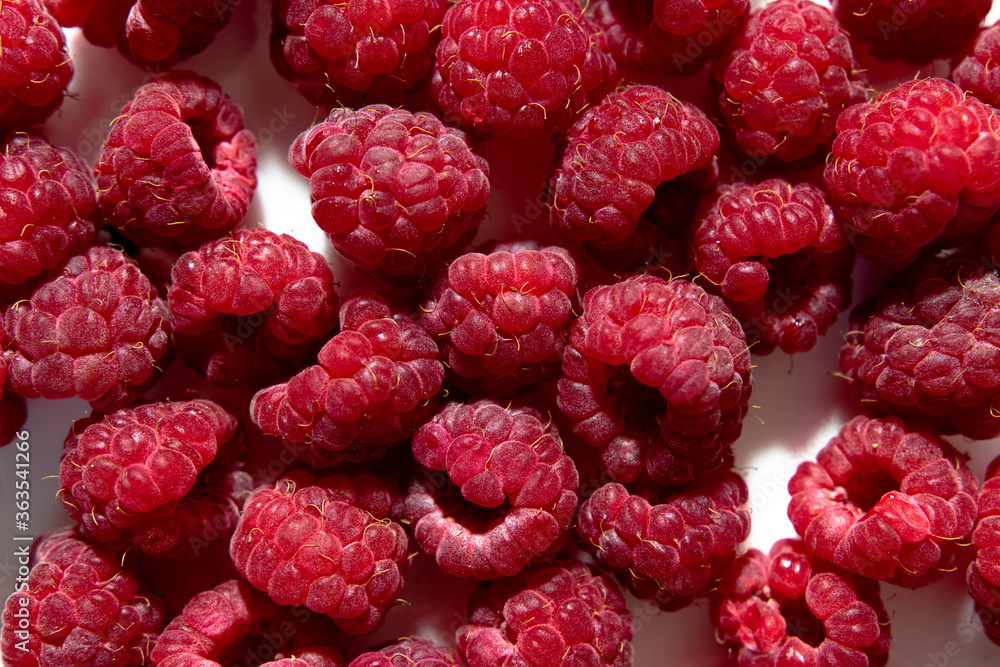 a lot of sweet fresh red raspberries on a plate from the market or garden a lot of sweet fresh red raspberries on a plate from the market or garden