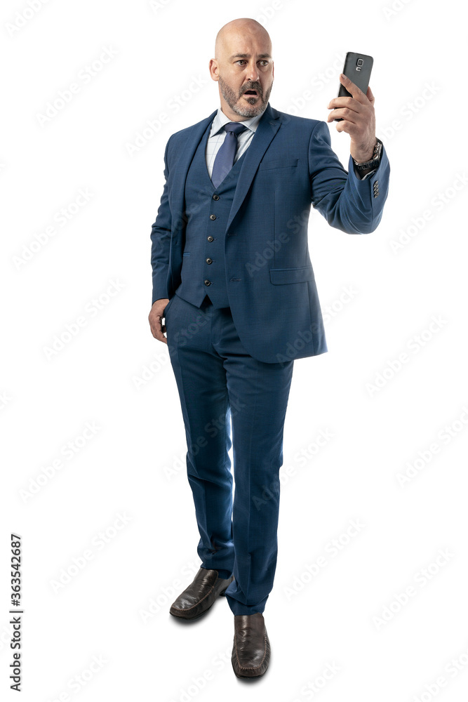 man in business suit on phone being surprised man in business suit on phone being surprised