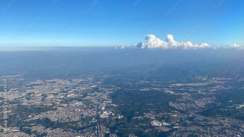 Aerial View Of Sea And Cityscape Against Sky