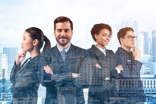 Photography Four successful smiling business consultants standing in a row in suits and ready to tackle with customer problem