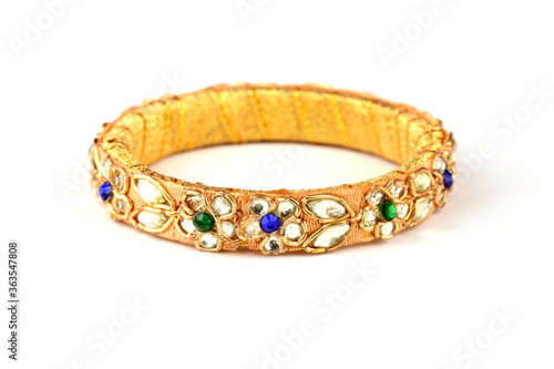 Indian golden Bangles. Bracelet with diamonds and stones on a white background, Indian Traditional Jewellery,Style, fashion and design of jewelry