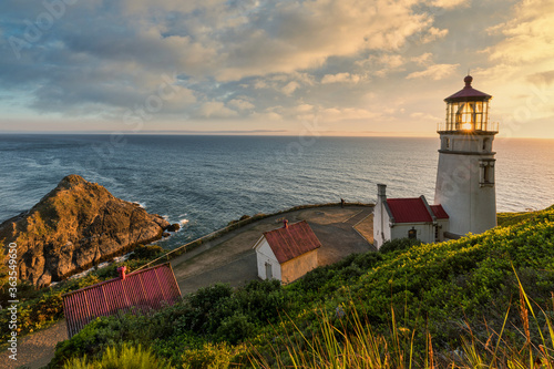 overlook of Heceta head lighthouse at sunset