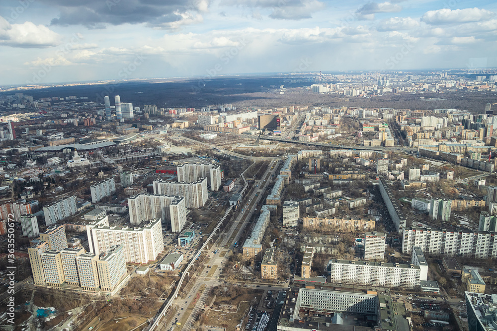 Russia, Moscow, 2019: view from the Ostankino TV tower to the panorama of the city, residential multi-storey buildings and the Cosmos hotel