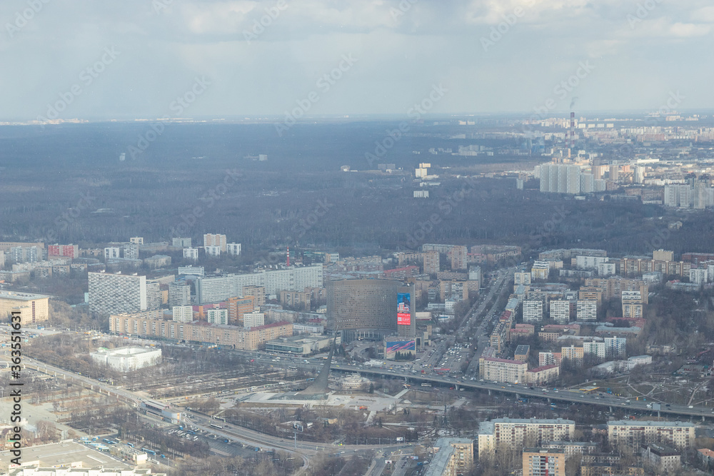 Russia, Moscow, 2019: view from the Ostankino TV tower to the city panorama, residential multi-storey buildings, the Cosmos hotel and the monument to space explorers
