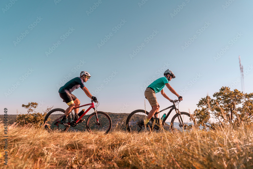 Man riding his mountain bike outdoor in nature Man riding his mountain bike outdoor in nature