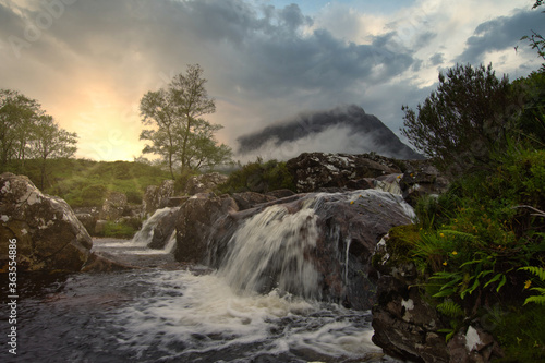 waterfalls of Glencoe with sun glow, Glencoe, highlands, Scotland.