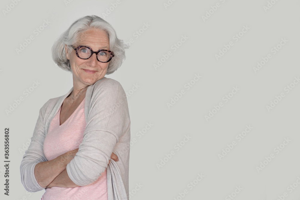 Portrait of senior woman with eyeglasses standing on white background, isolated Portrait of senior woman with eyeglasses standing on white background, isolated