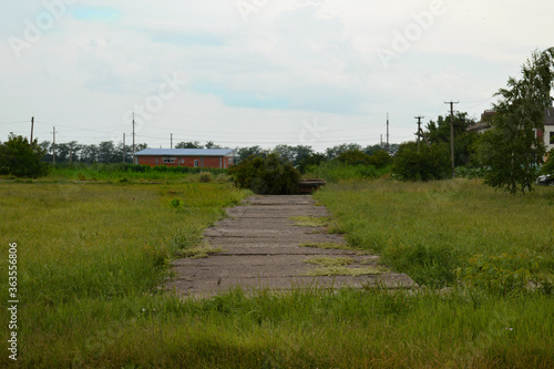 Rural area, the path is short of concrete slabs.