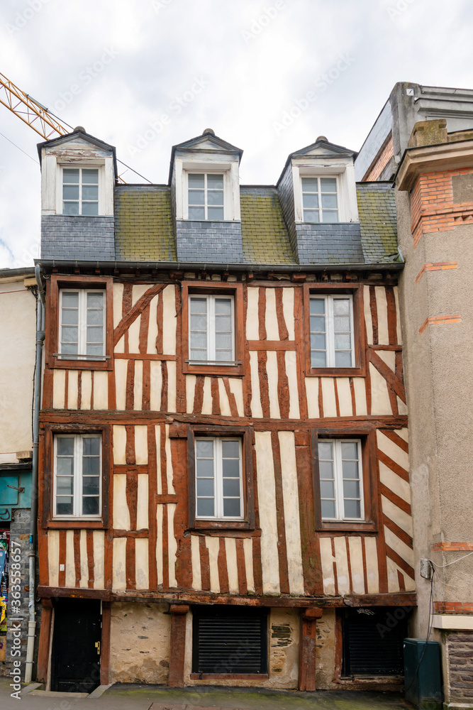 Obraz premium RENNES, FRANCE - April 28, 2018: Antique building view in Old Town in Rennes, France