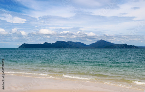 Beach with blue water and background of small island at Langkawi Malaysia, Asia