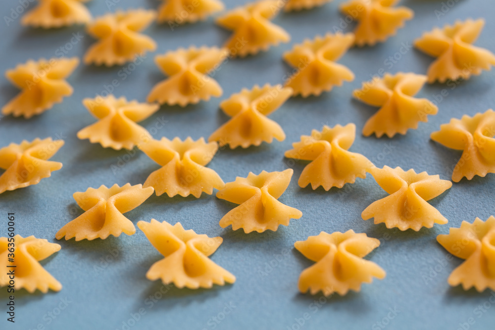 farfalle pasta on blue background farfalle pasta on blue background