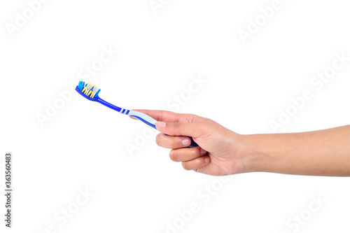 Toothbrush in woman's hand isolated on white background
