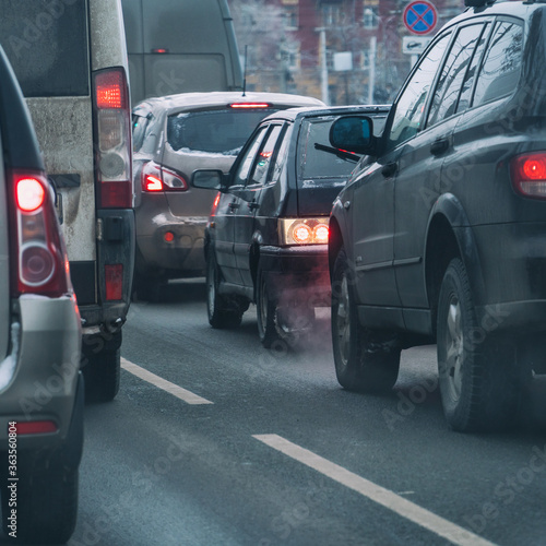 Cars standing in a traffic jam on city street