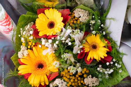 Fototapeta Naklejka Na Ścianę i Meble -  top view of bouquets of fresh yellow flowers. gift for holiday or anniversary.