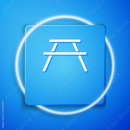 White Picnic table with benches on either side of the table icon isolated on blue background. Blue square button. Vector Illustration.