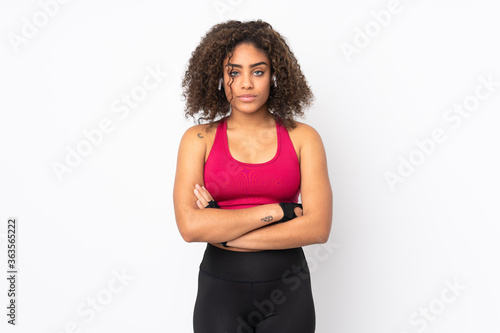 Young African American sport woman isolated on white background with arms crossed
