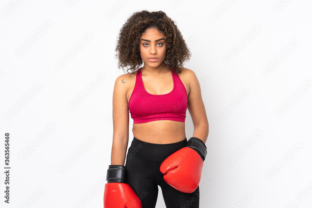 Young African American sport woman isolated on white background with boxing gloves Young African American sport woman isolated on white background with boxing gloves