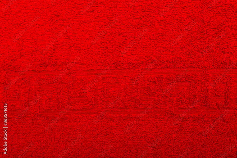Terry towel, texture, textile background close up. Terry red towel background. Color red terry towel made of cotton fabric. Structure with uncut thread loops. red towel background Terry towel, texture, textile background close up. Terry red towel background. Color red terry towel made of cotton fabric. Structure with uncut thread loops. red towel background