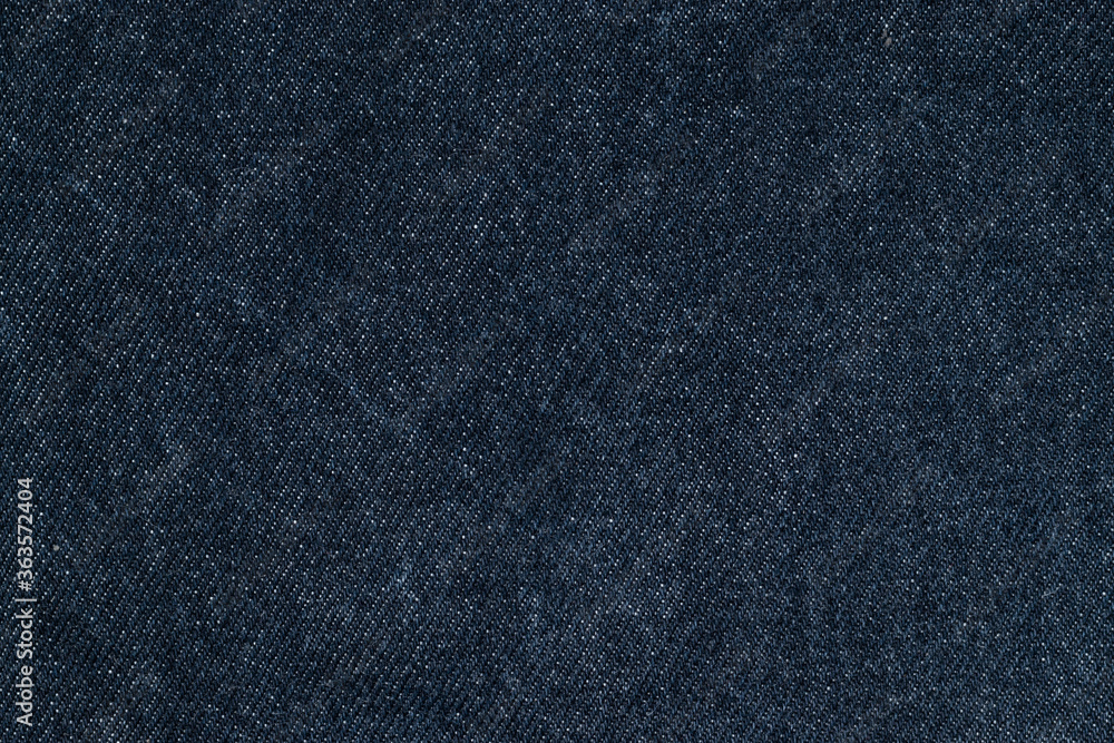 Texture details of dark blue jeans. Close up textile for background. Texture details of dark blue jeans. Close up textile for background.