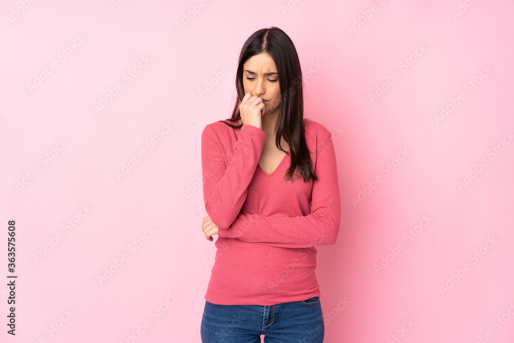 Young caucasian woman over isolated background having doubts Young caucasian woman over isolated background having doubts