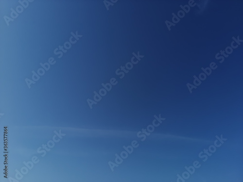 blue sky with scattered transparent clouds