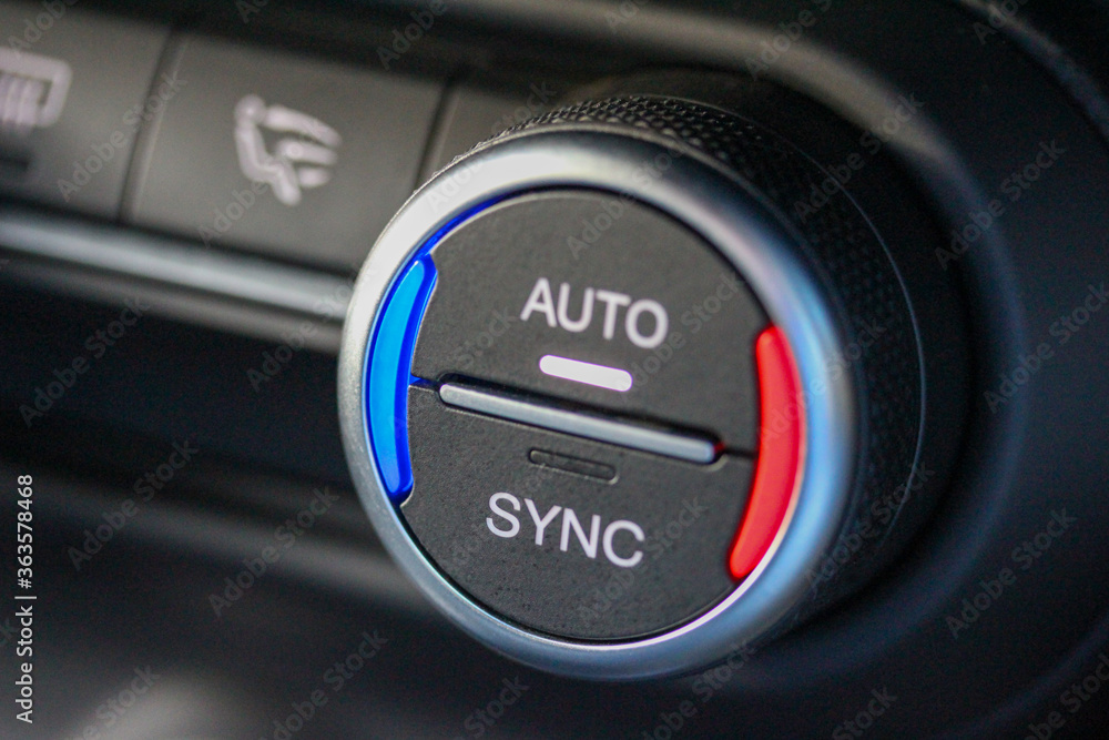 AUTO / SYNC ventilation knob in luxury vehicle