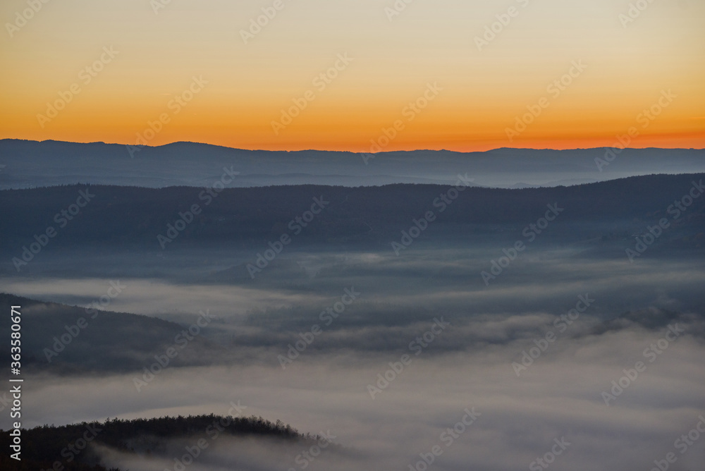 Sunrise and morning haze on mountain Sunrise and morning haze on mountain