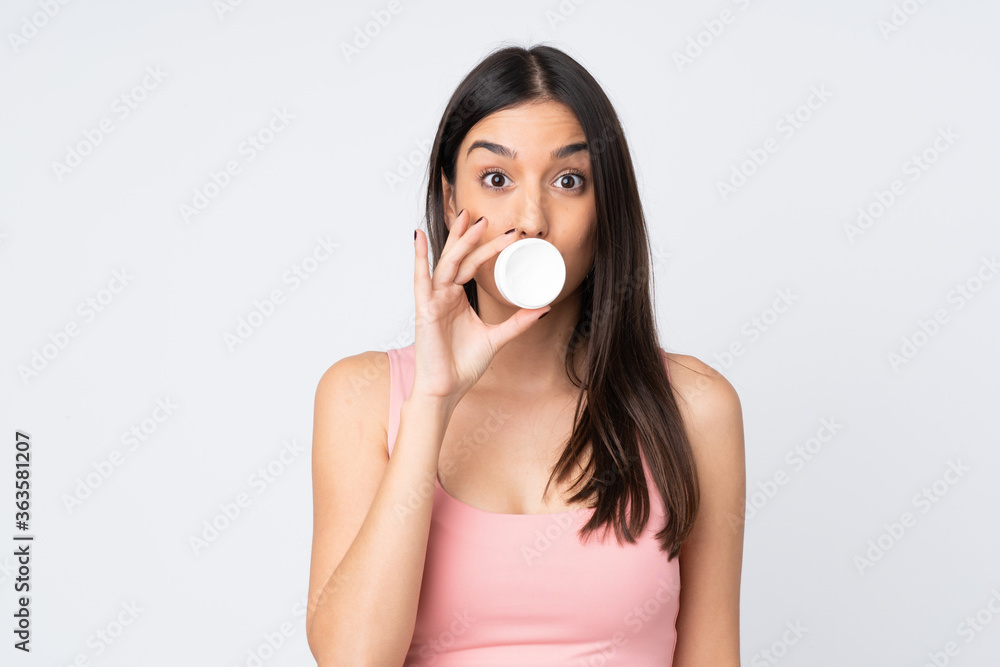 Young caucasian woman isolated on white background with moisturizer Young caucasian woman isolated on white background with moisturizer