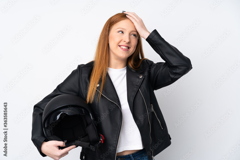 Young redhead woman with a motorcycle helmet over isolated white background has realized something and intending the solution Young redhead woman with a motorcycle helmet over isolated white background has realized something and intending the solution