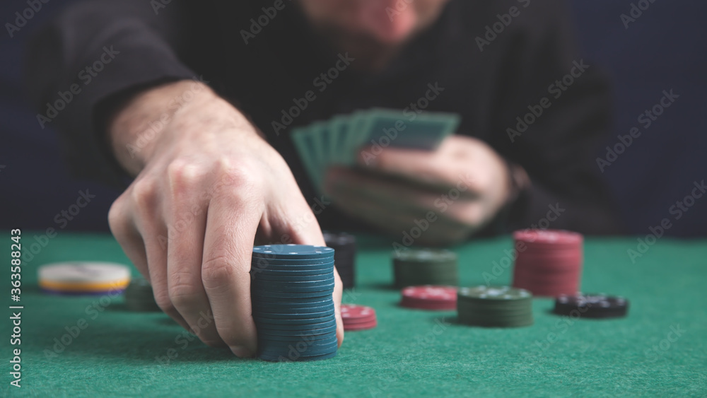 Man holding poker chips. Casino Man holding poker chips. Casino