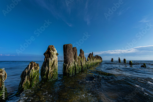 Breakwater at the shore of the Baltic Sea against the backdrop of water and sky