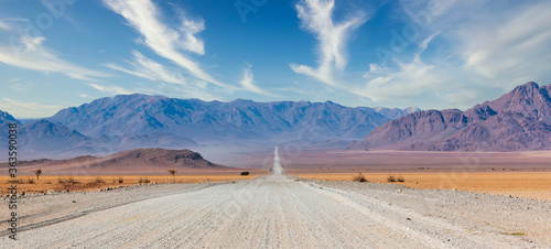 Fotografia, Obraz Gravel road and beautiful landscape in Namibia