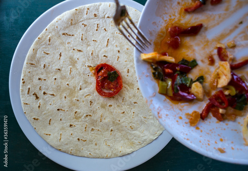 Cooking pita rolls stuffed with vegetables, Pita bread in a pan. photo