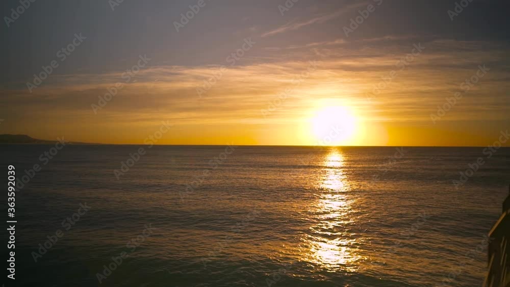 Sunrise over the sea. A beam of light shines on the water at the spanish coast. Sunrise over the sea. A beam of light shines on the water at the spanish coast.