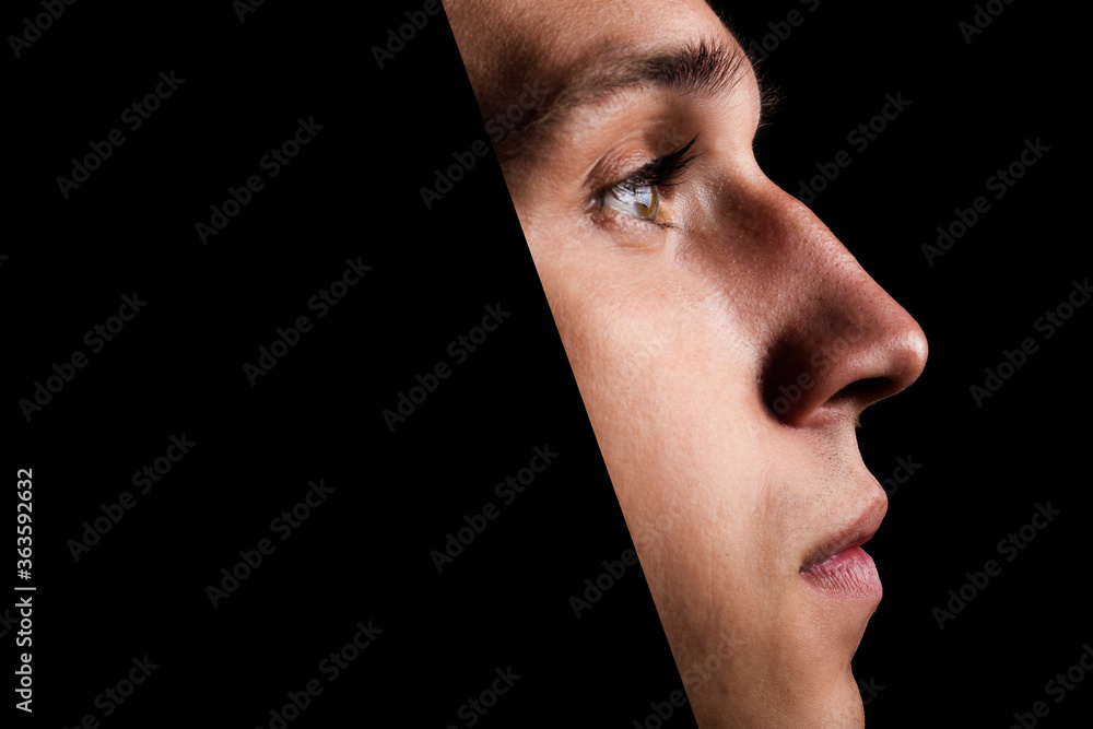 Guy in the hood in profile. Brutal man on a black background. Guy in the hood in profile. Brutal man on a black background.