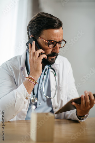 consultation of a doctor on tablet and computer