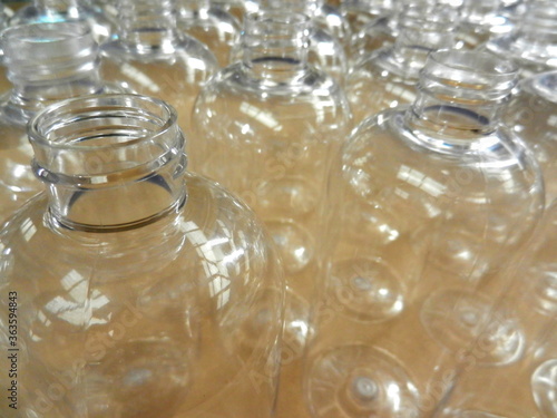 clear plastic bottles awaiting filling with product