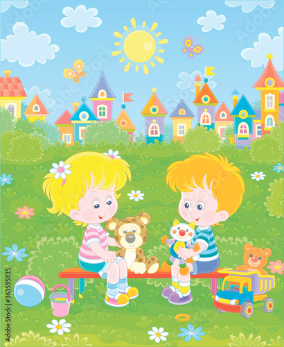Cheerful small children sitting on a bench  talking and playing with their funny colorful toys on a summer playground in a park on a sunny day  vector cartoon illustration