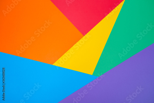 Abstract geometric color paper background like a LGBTQ pride flag. Minimalistic shapes and lines rainbow backdrop. Copy space for your creative design, text. LGBTQ human rights and freedom concept.