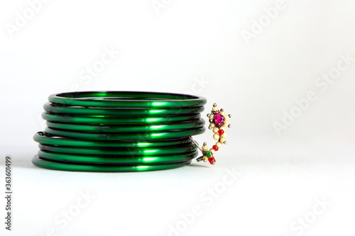 Green bangles in front of Maharashtrian nose pin ( Marathi Nath ) photo