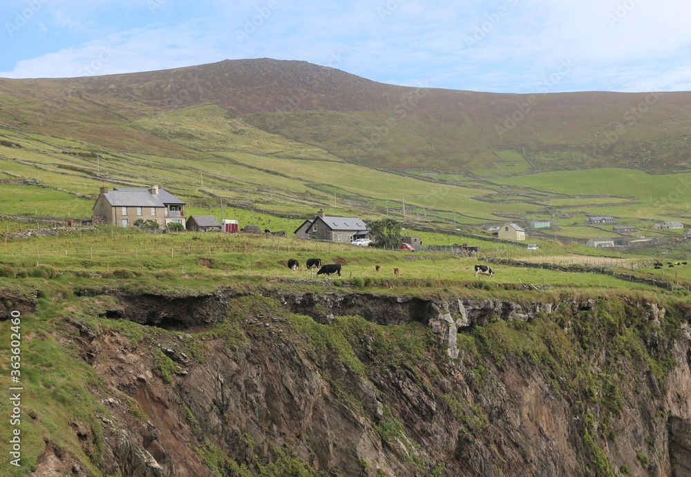 A rural farming hamlet perched above the crumbling cliffs on the Slea Head Drive, Dingle Peninsula, Ireland.
