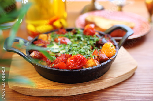 Vegetable shakshouka, a dish of Jewish cuisine. 
Appetizing dish. Suggestion of serving a dish. Culinary Photography.