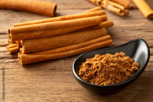Close up cinnamon powder in a bowl background