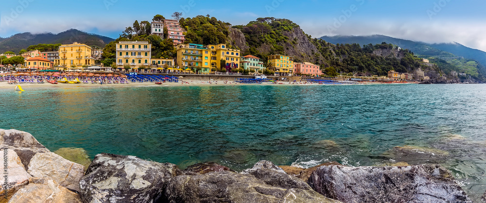 A panorama view from the sea wall towards the beach at Monterosso al Mare, Italy in summer
