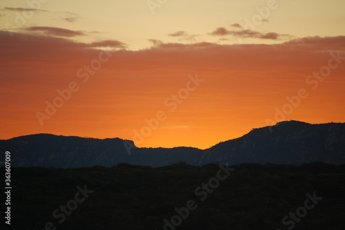 Sunset over the hills of the Brazilian Northeast with an orange sky
