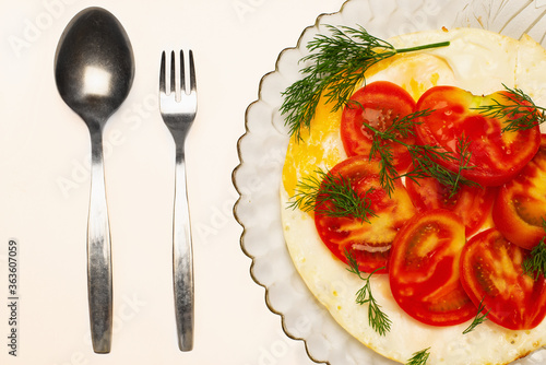 Element of delicious instant breakfast in a plate with spoon and fork.