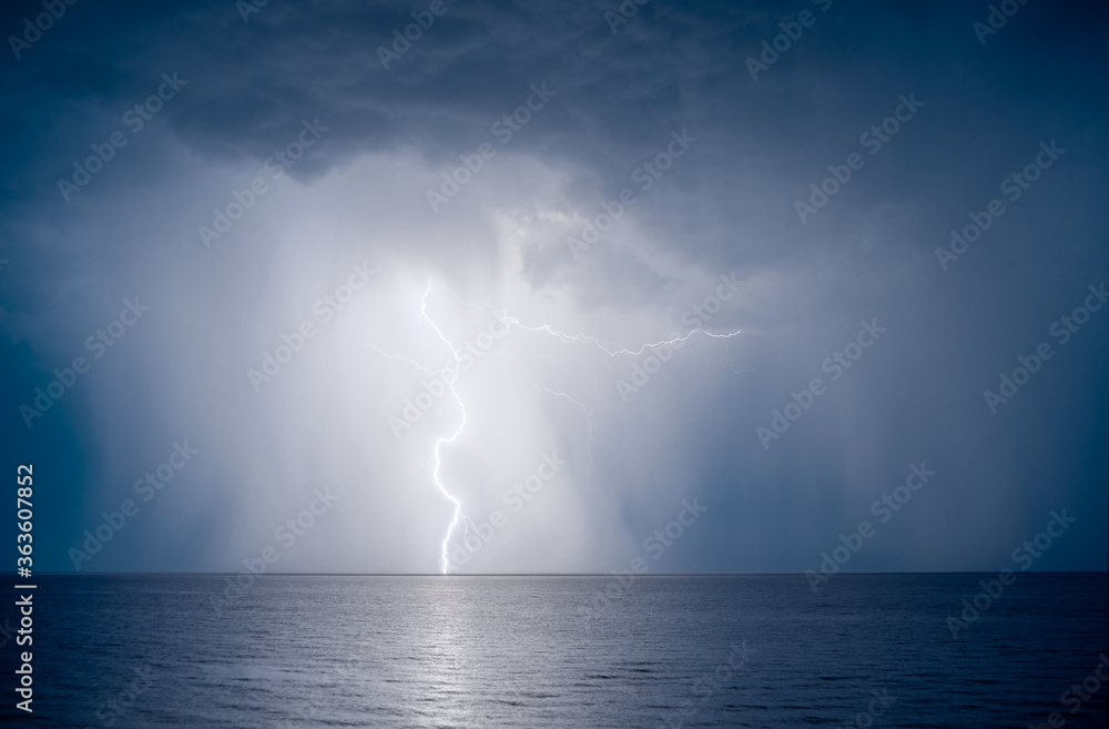 lightning over the sea in the night