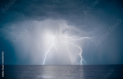 lightning over the sea in the night