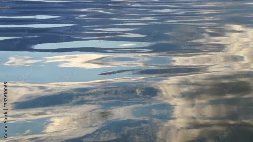 Sea waves with reflection of the evening sun for the background