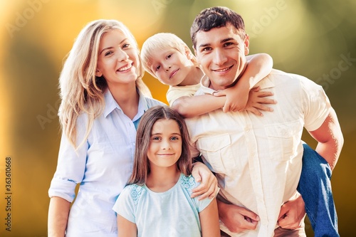 Beautiful smiling lovely family on outdoor background